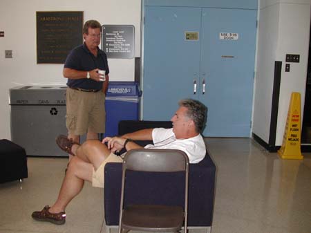 Caifson Russell talks to another attendee during a break