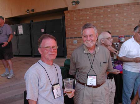 Michael Hersh and Perry Main enjoy the Sunday evening social. Gene Hall and Luis Lloréns are in the background