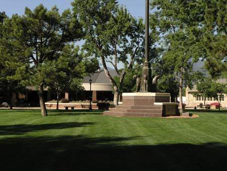 The campus flag pole showing Colorado College tigers with Worner Center behind. Photo courtesy of Chet Kenisell