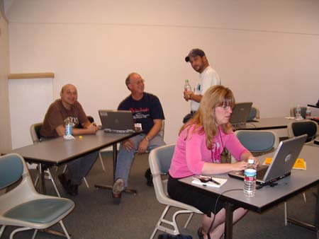 The Help desk in action with Mauro Rech, John Chapman, Lee Karns, and Cheryl Johnson