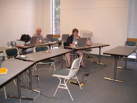 Gene Hall and Tami Rivera working at the Help Desk