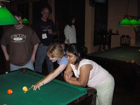 After hours at Phantom Canyon Brew Pub. Troy Stratton and John Chapman watch Ellie Hickey and Anili George play pool. Photo courtesy of Michael Ormes.